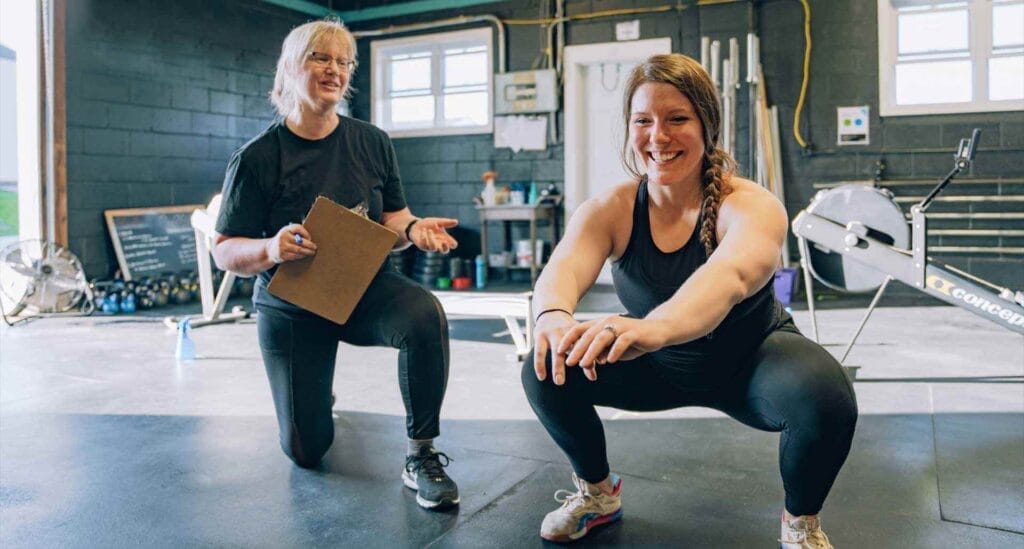 coach teaching proper lifting technique at Marble Strength Freehold NJ gym