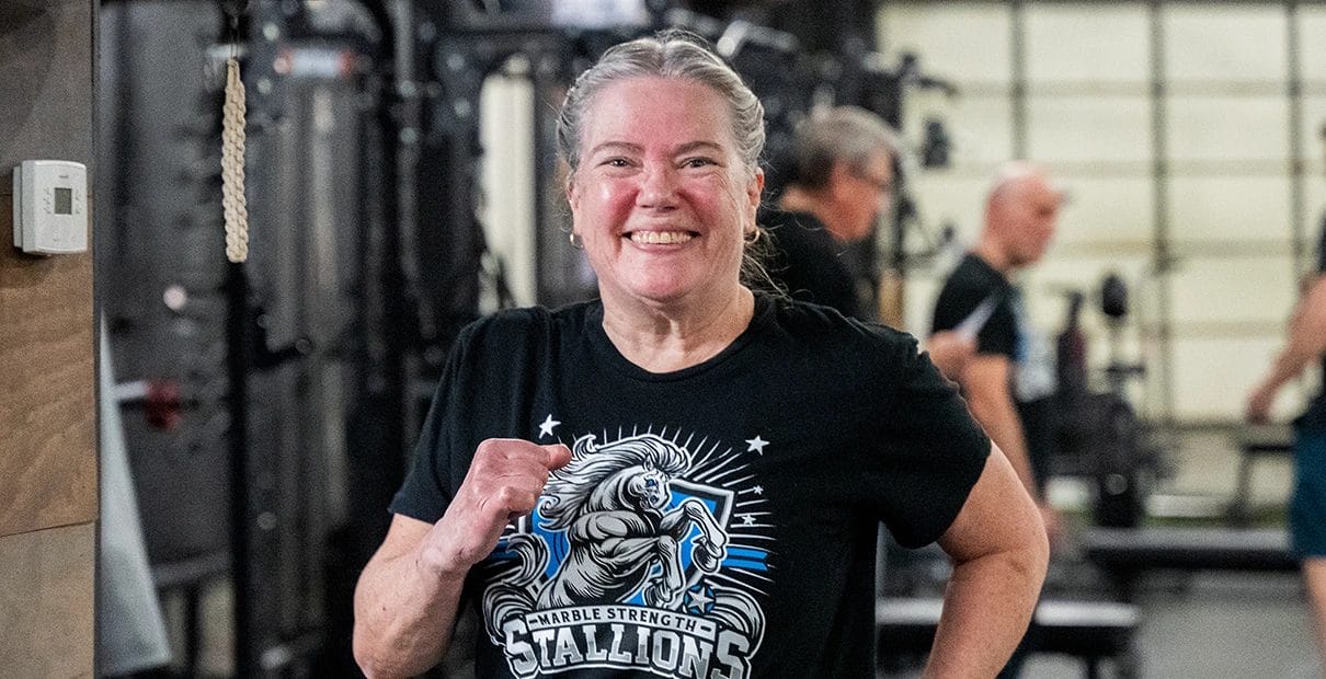 happy woman training at Marble Strength