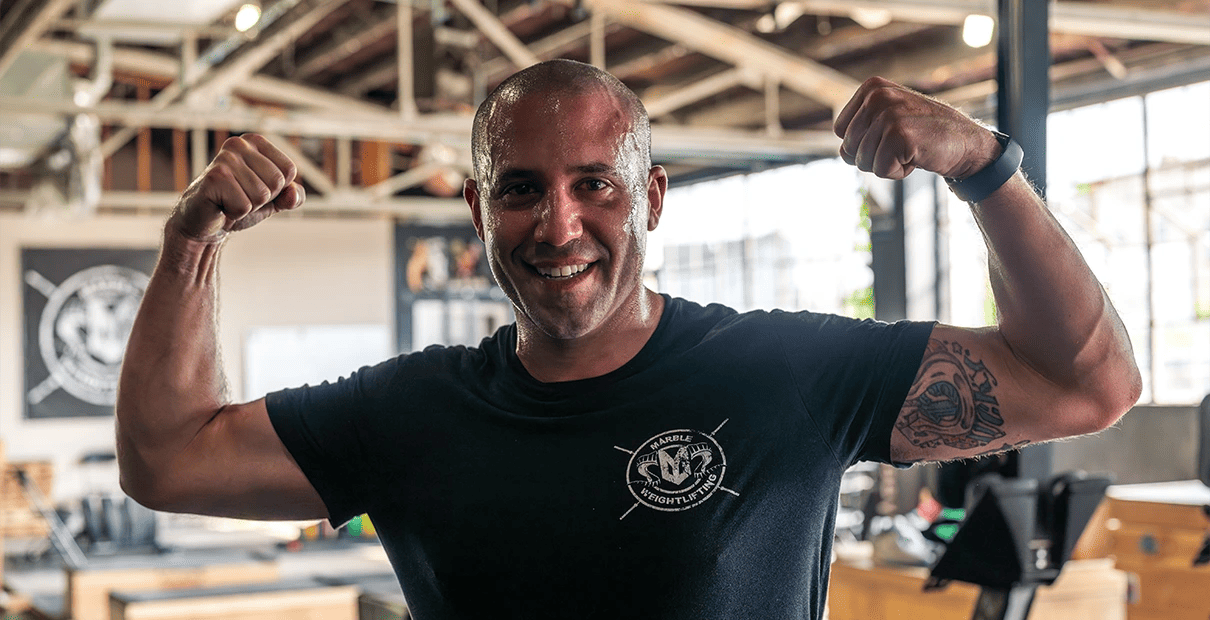 How to Stay on Track During the Holidays Without Restricting Yourself 1 man sweating after working out at Marble Strength