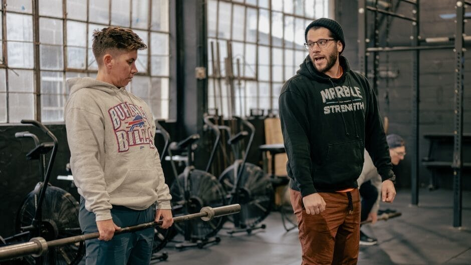 How to Build Strength After 40 in Freehold, NJ 3 trainer coaching proper deadlift technique at Marble Strength in Freehold NJ
