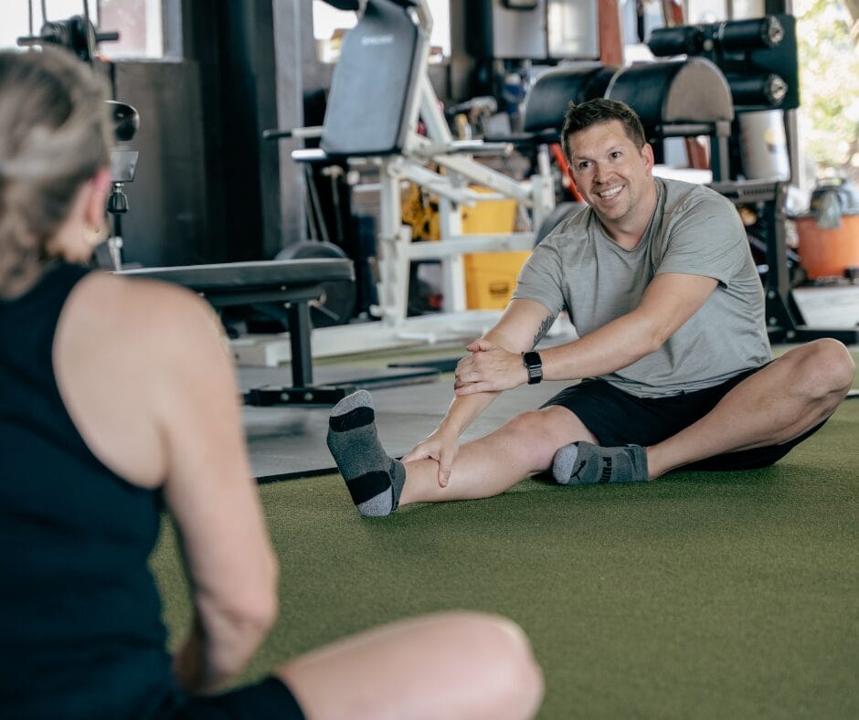 How to Stay on Track During the Holidays Without Restricting Yourself 3 Coach leading strength training session during holiday season at Marble Strength Freehold NJ